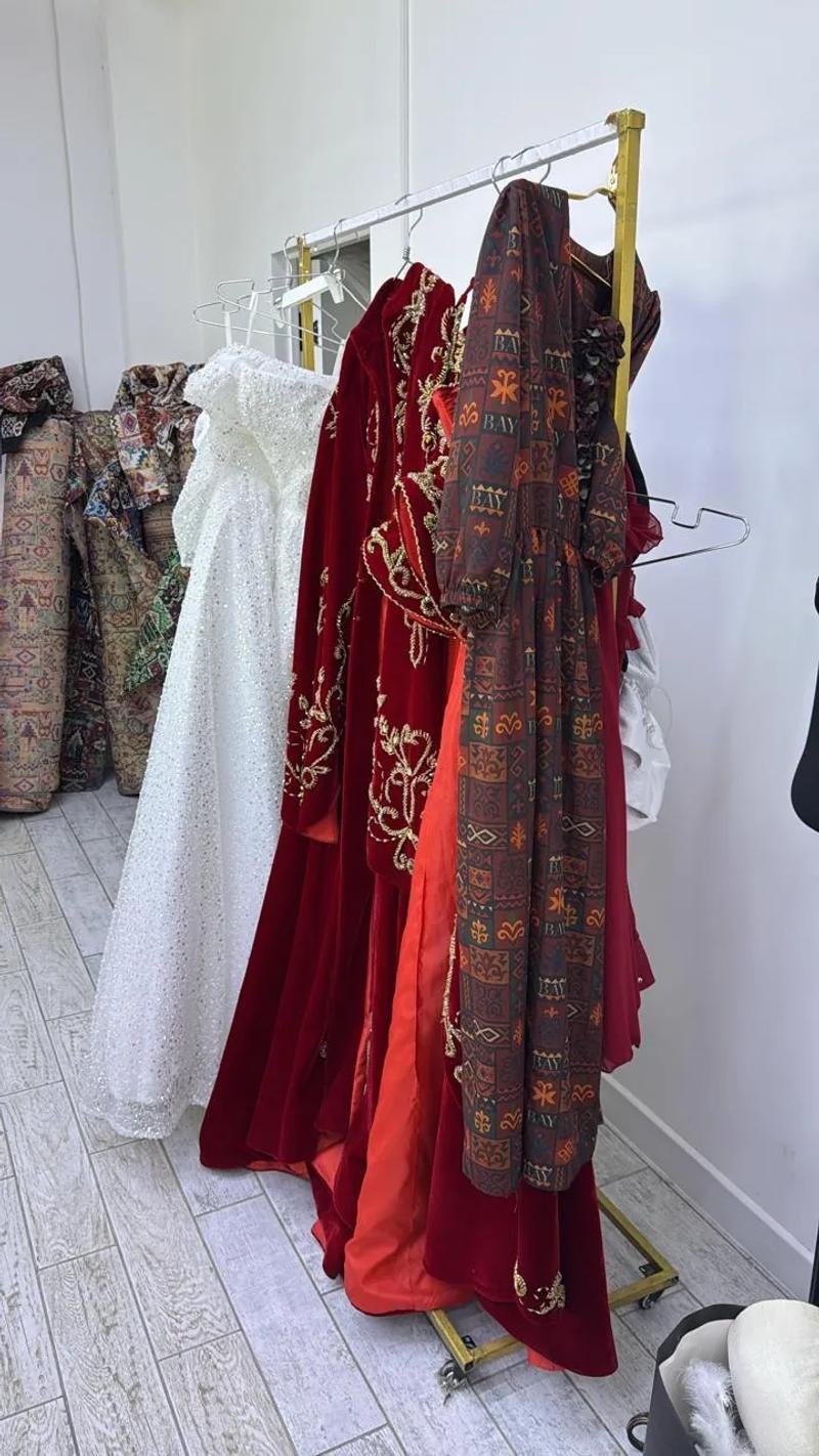 Dresses on a rail in the workshop