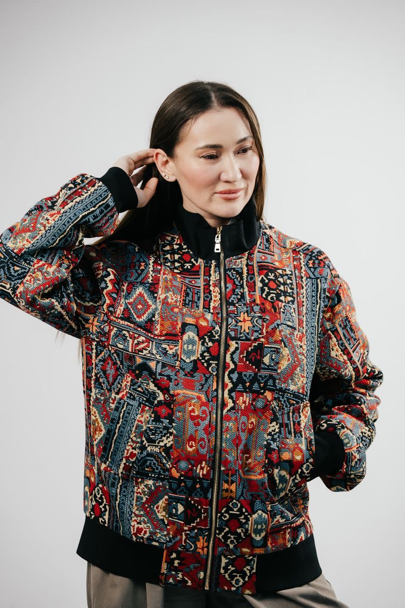 Banu Gaidar in a BAY bomber, hand in her hair