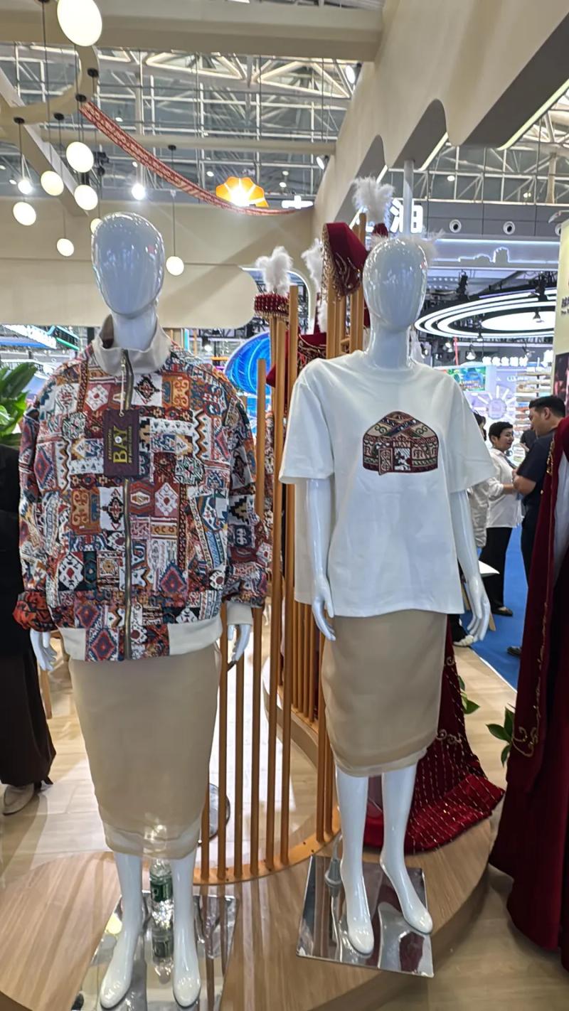 A BAY bomber and T-shirt on mannequins at the stand