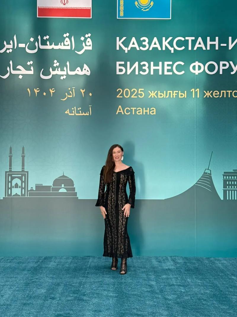 Banu Gaidar in front of the Kazakhstan–Iran Business Forum banner
