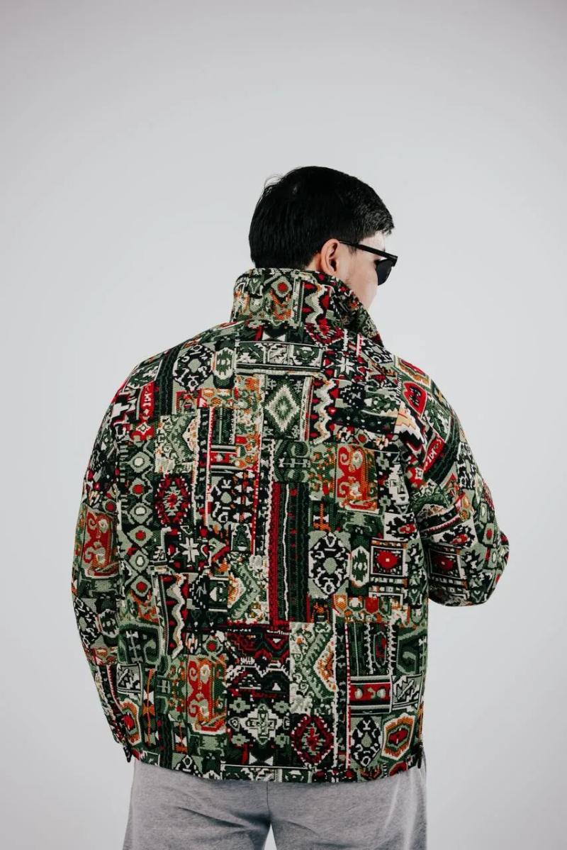 A green BAY bomber from the back
