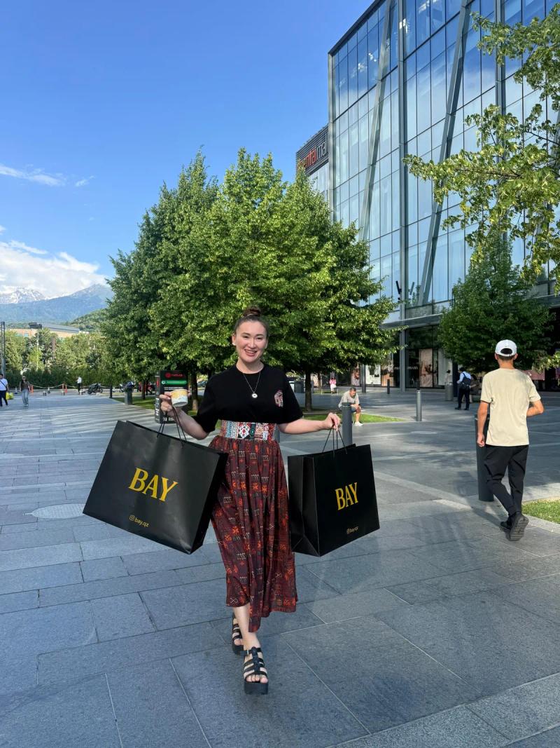 Banu Gaidar walks with BAY bags