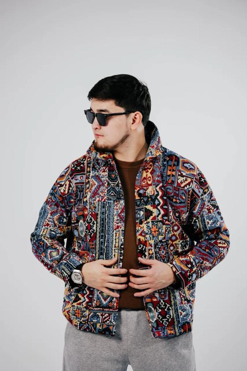 Model in a BAY bomber with a blue and red pattern