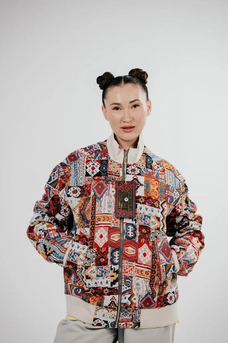 Banu Gaidar in a BAY bomber, studio portrait