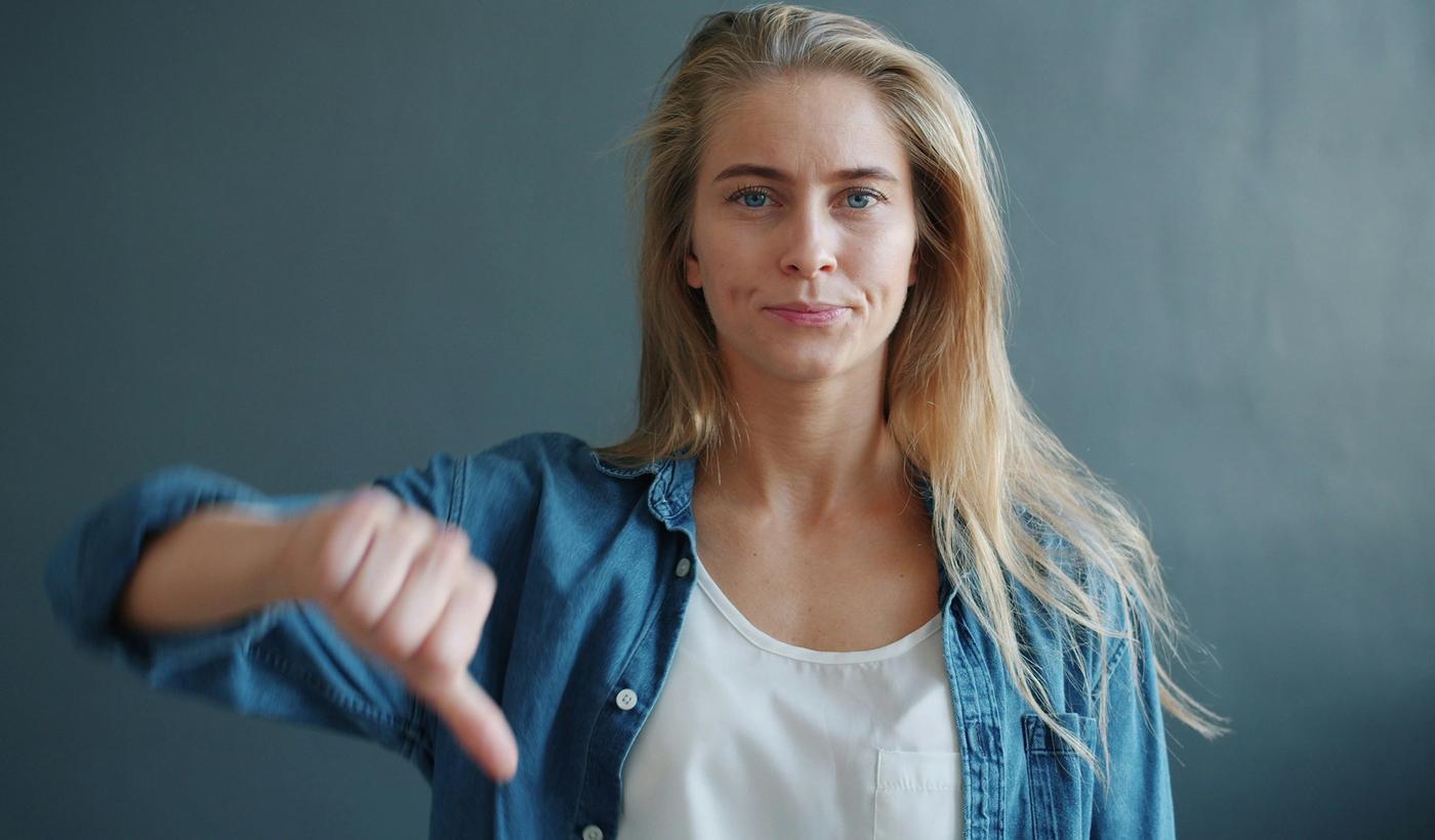Woman giving a thumbs down gesture