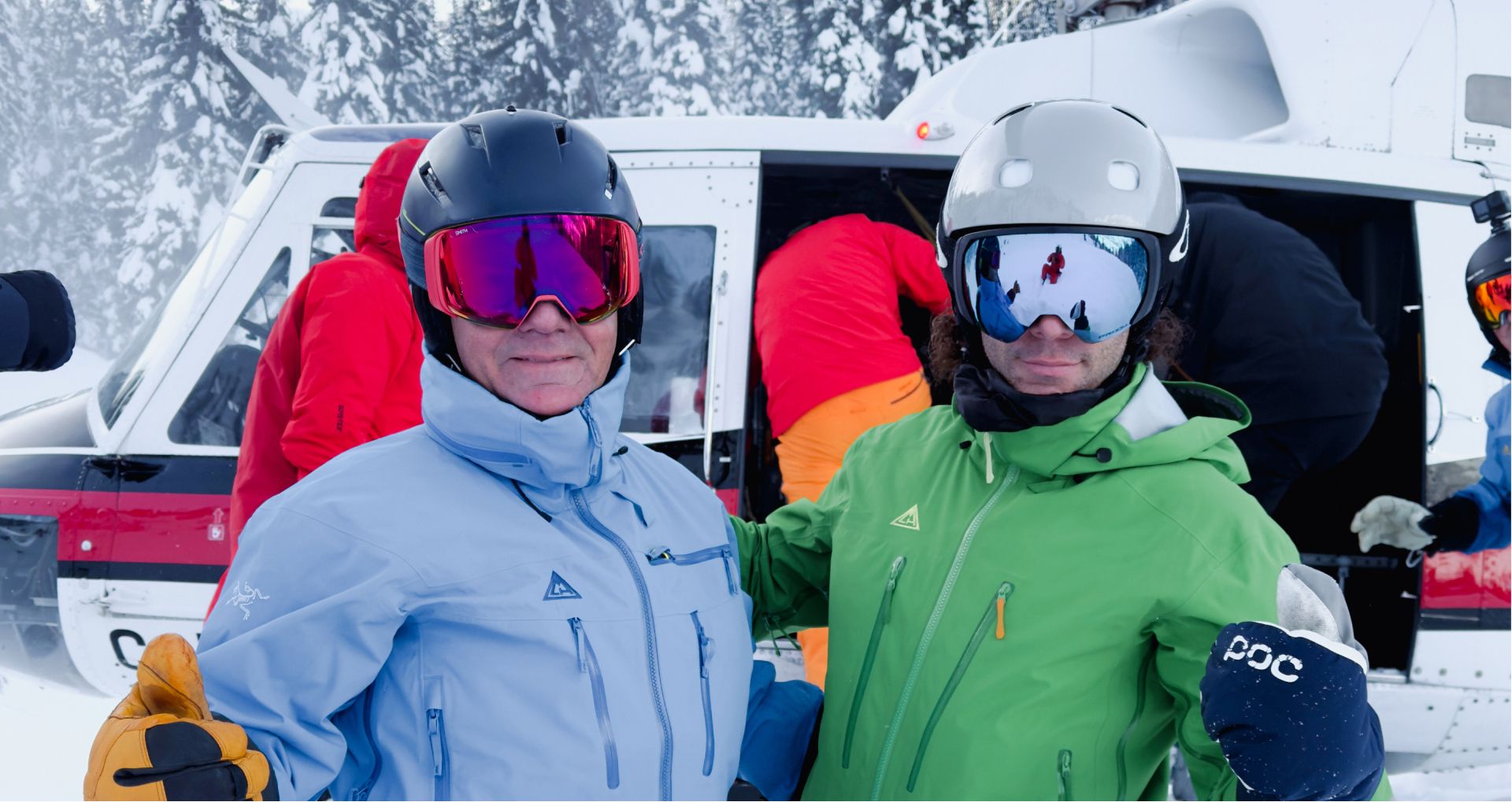 Two skiers posing for the camera