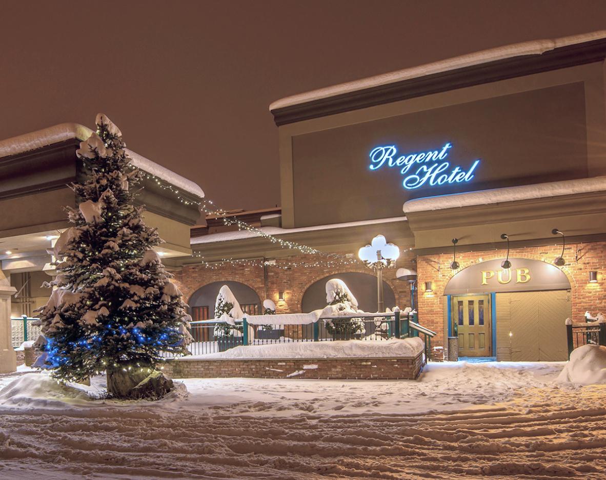 The outside of the regent hotel seen at night