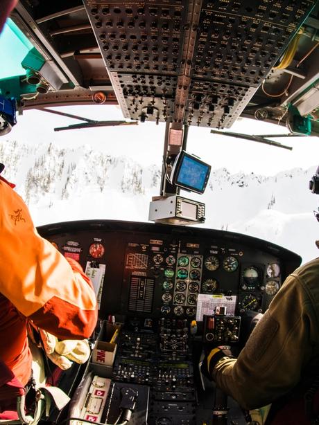 CMH ski guide and a pilot flying a helicopter. 