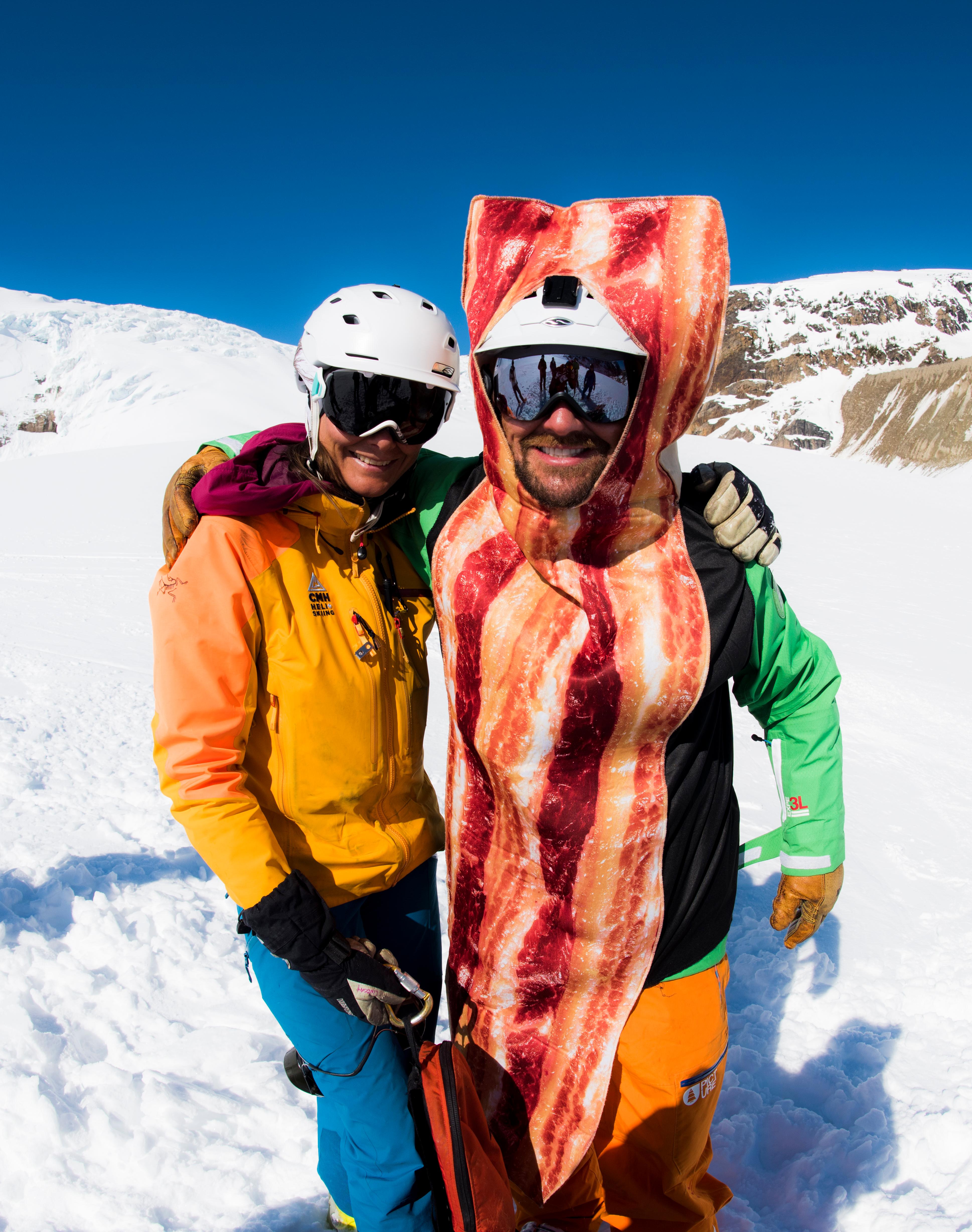 A CMH ski guide posing with a guest