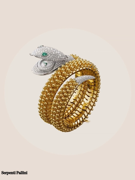 Montre Serpenti or jaune tete en diamant et émeraudes