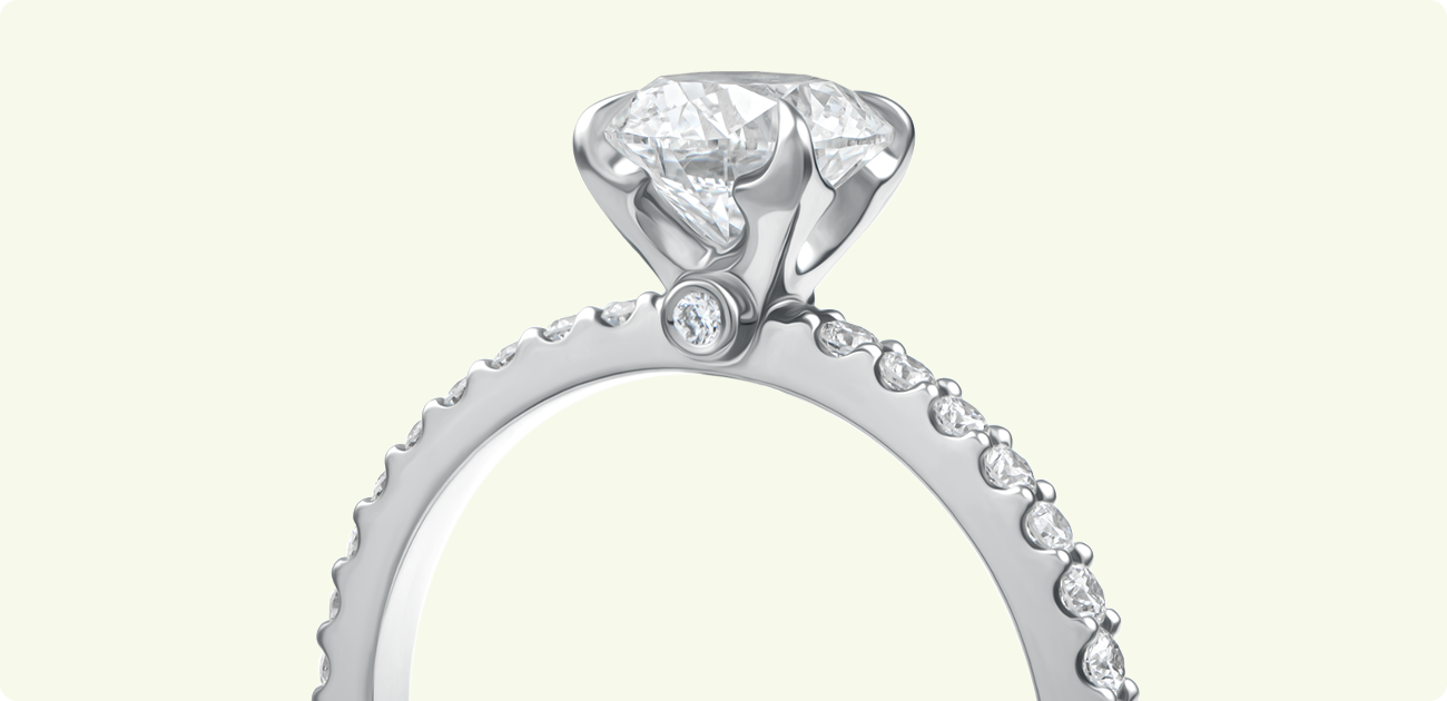 Side profile of a handcrafted diamond engagement ring from the Nord-Ouest collection by Château D’Ivoire, featuring a snowflake-inspired setting and pavé diamonds, set against a technical jewelry design sketch.
