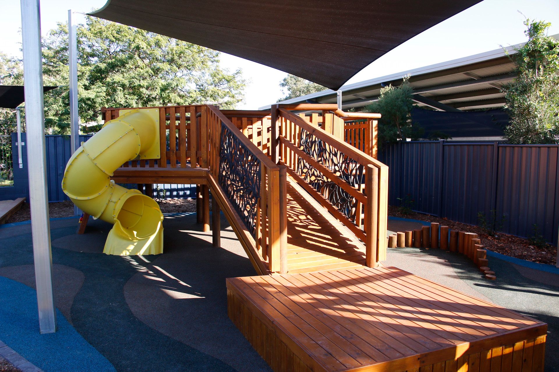 A playground with slide and climbing frame