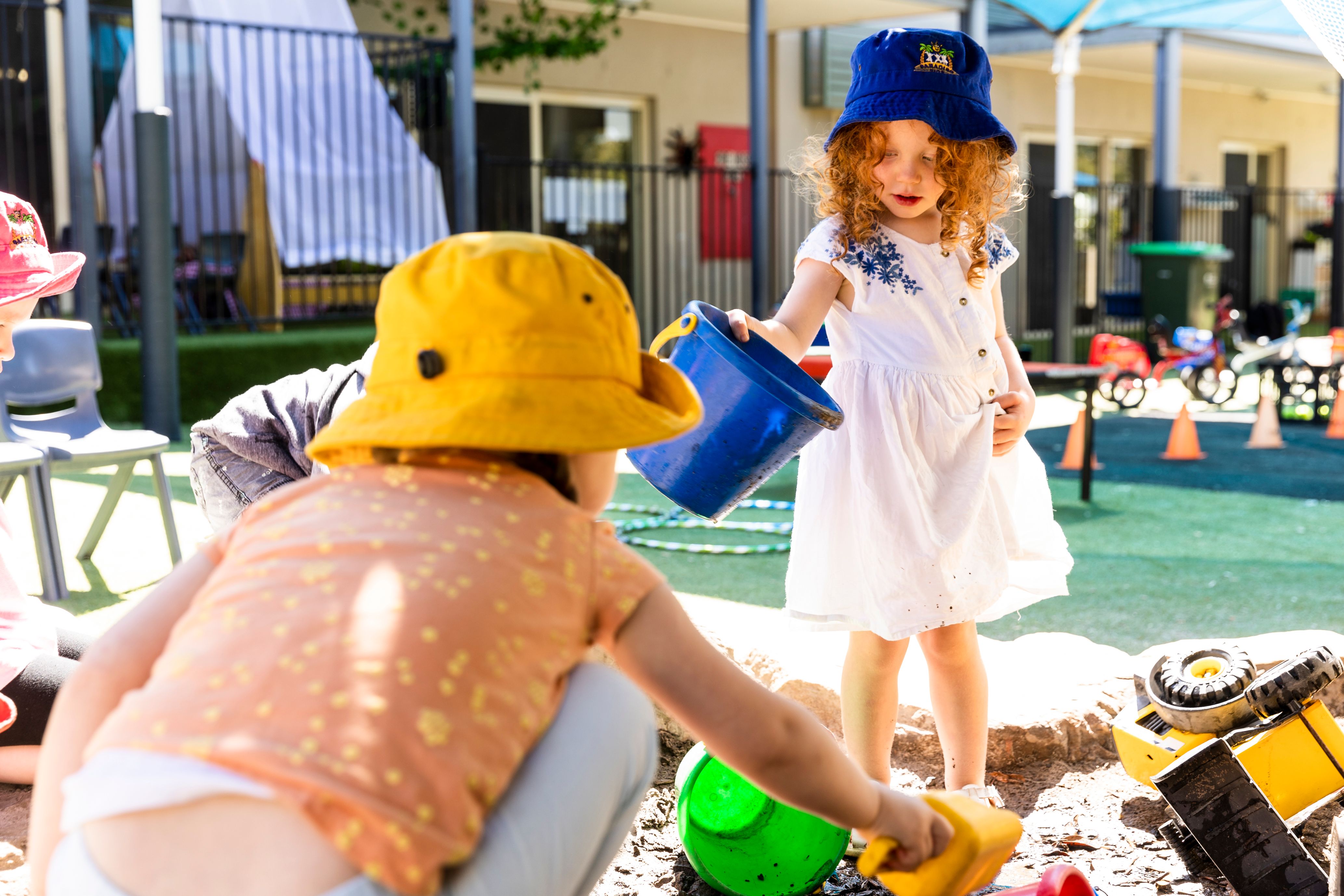Some children playing in a sandpit
