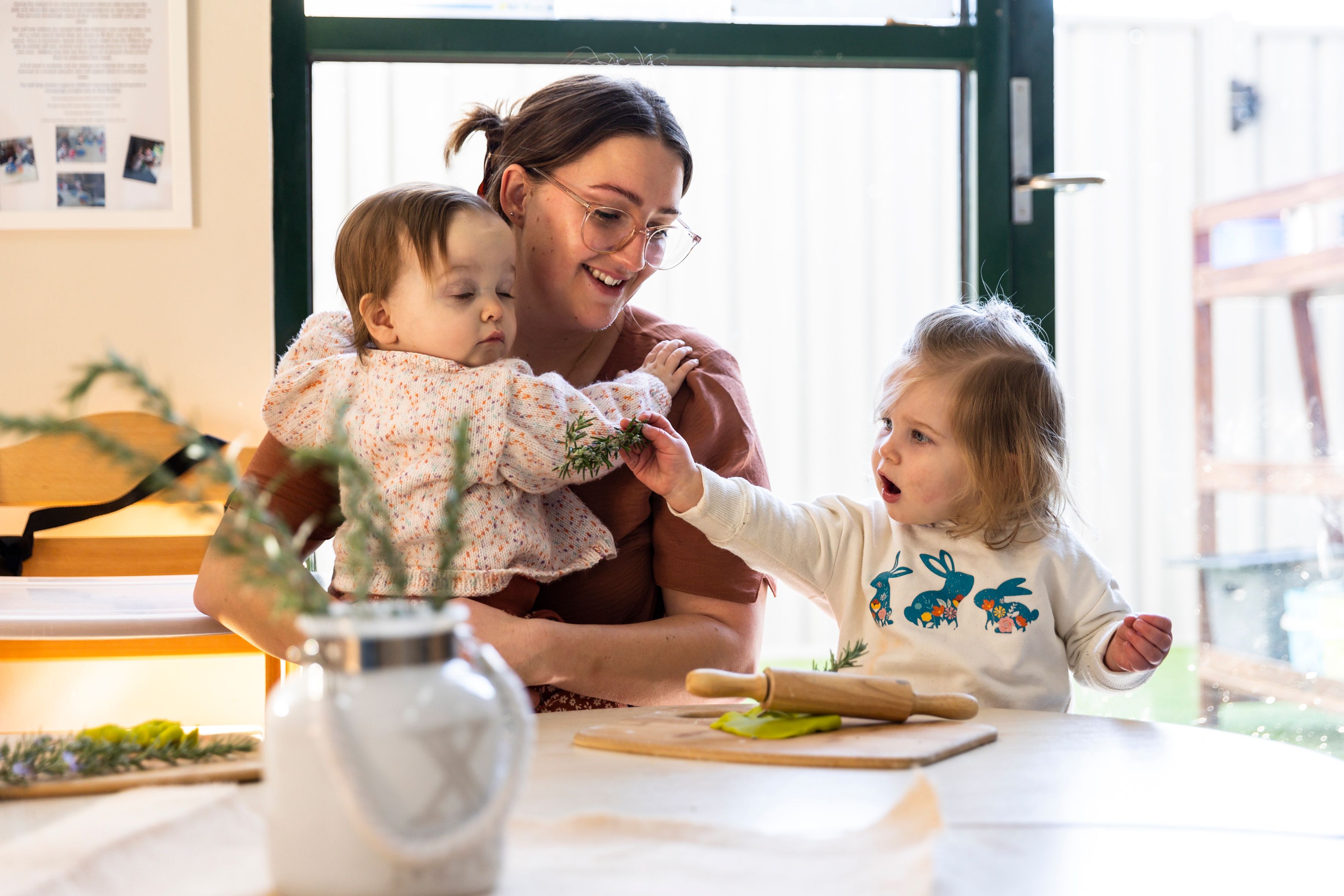 An educator playing with two children