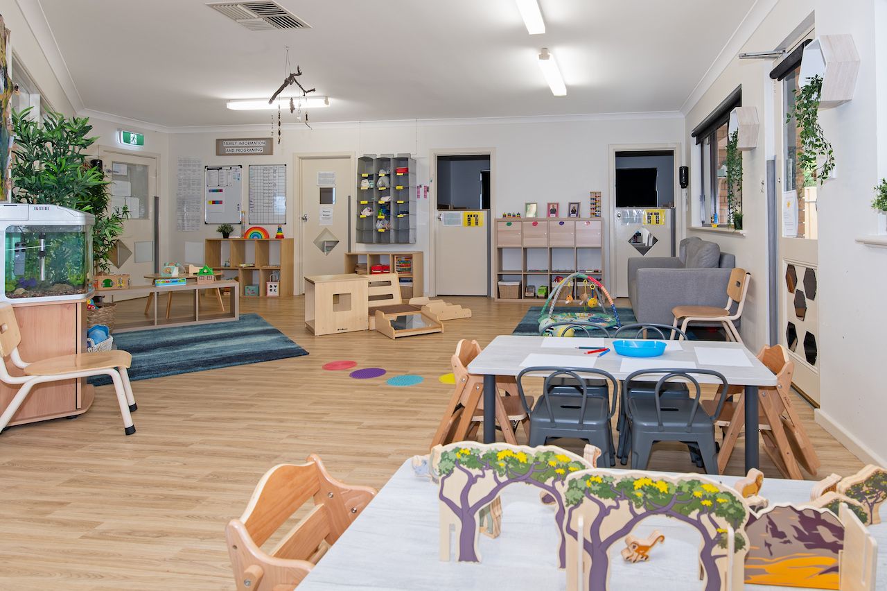 A large classroom filled with toys and play equipment