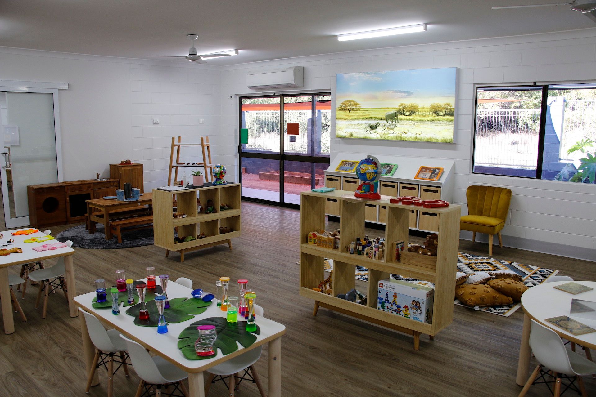 A classroom equipped with toys, books and furniture