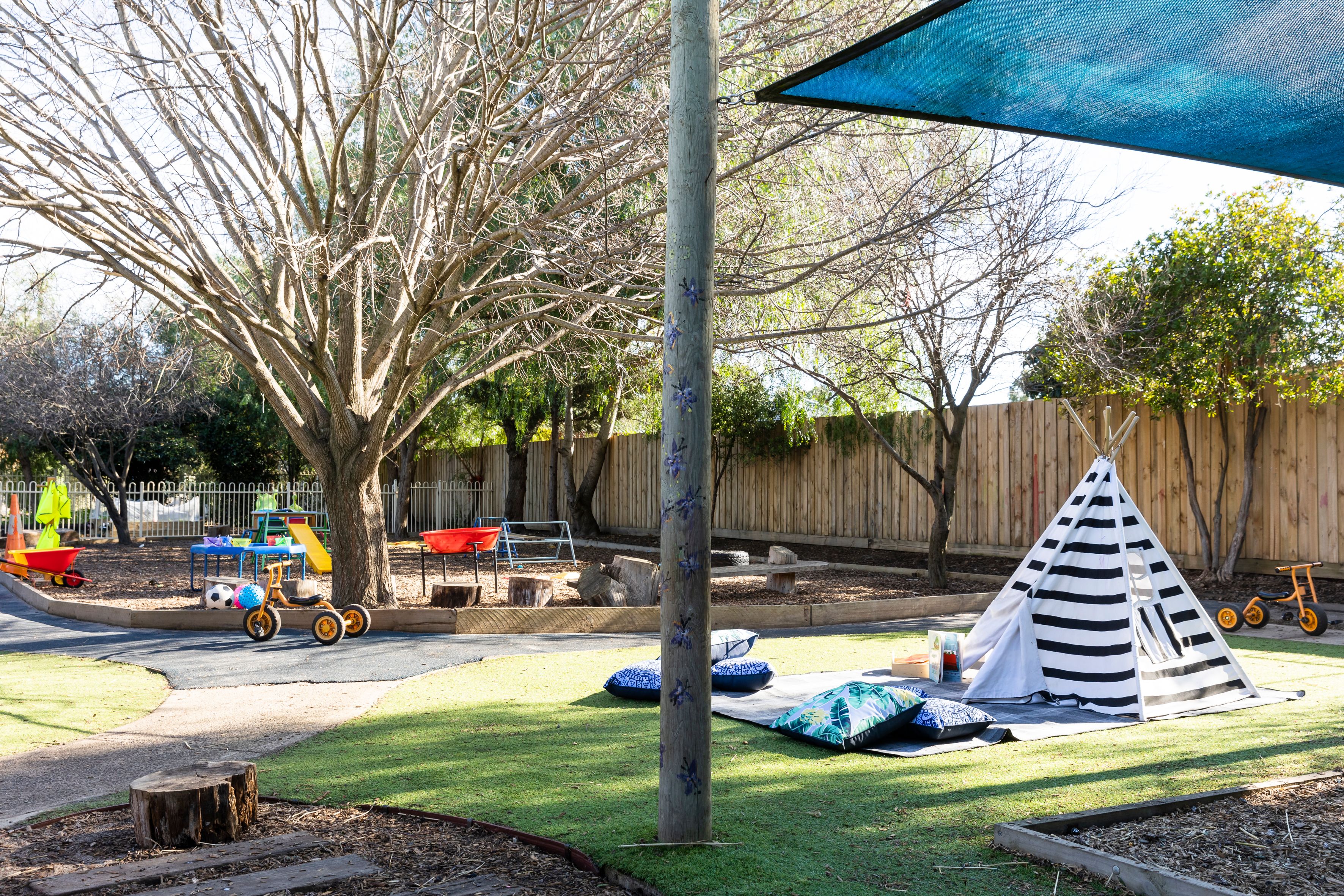 Shaded garden with toys and furniture