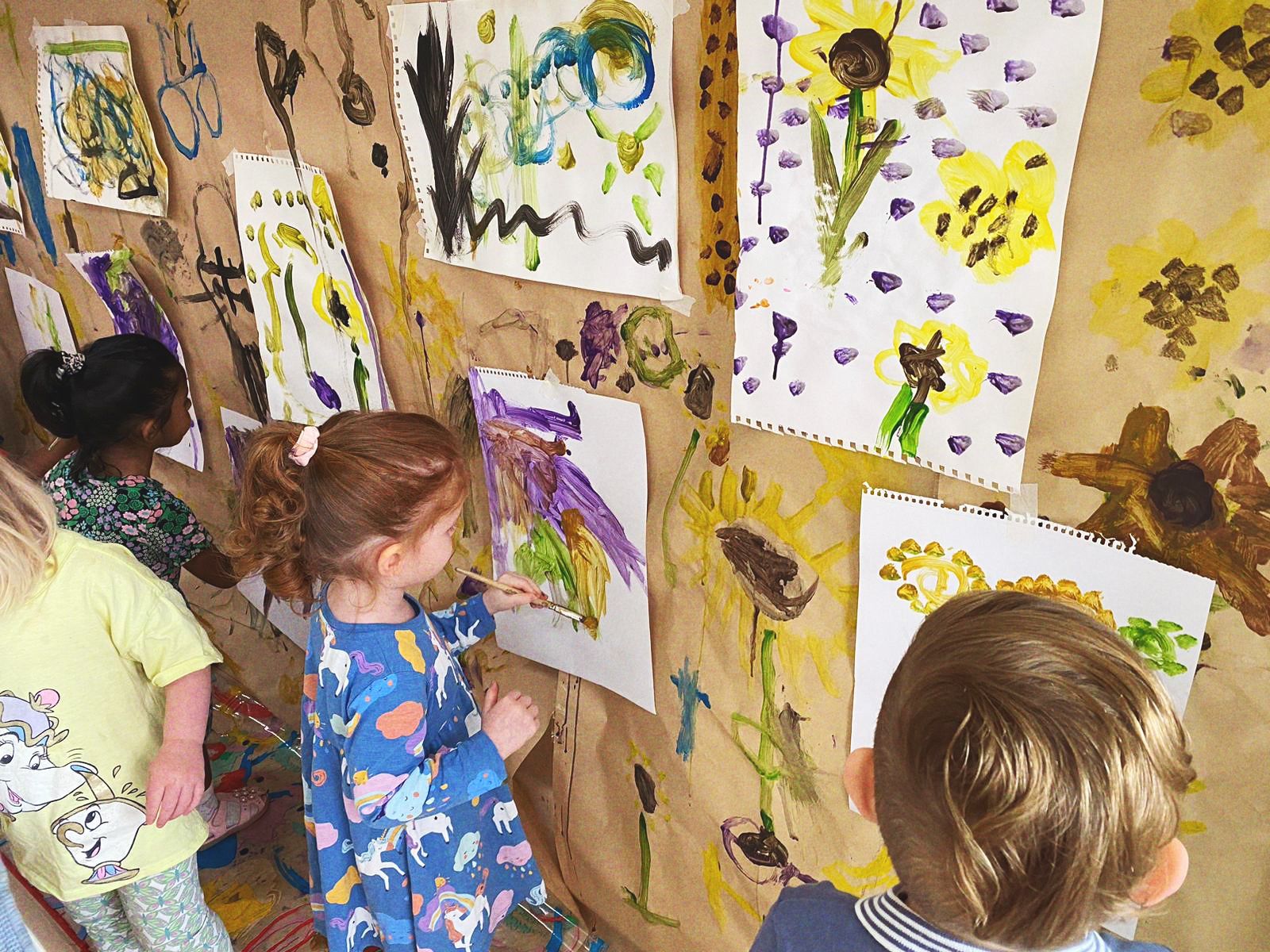 Children painting on wall