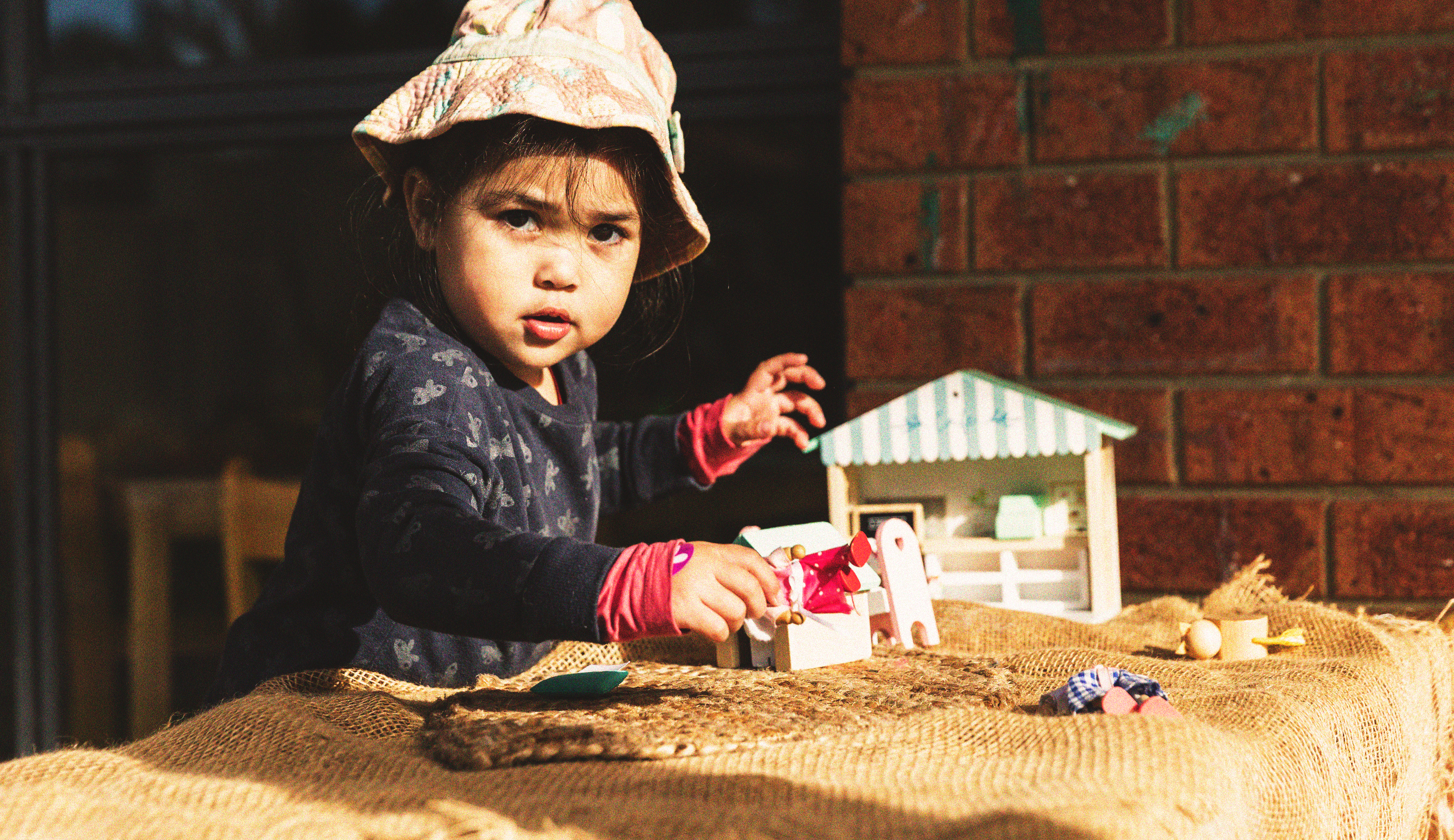 Some young boys stretching their arms into the air