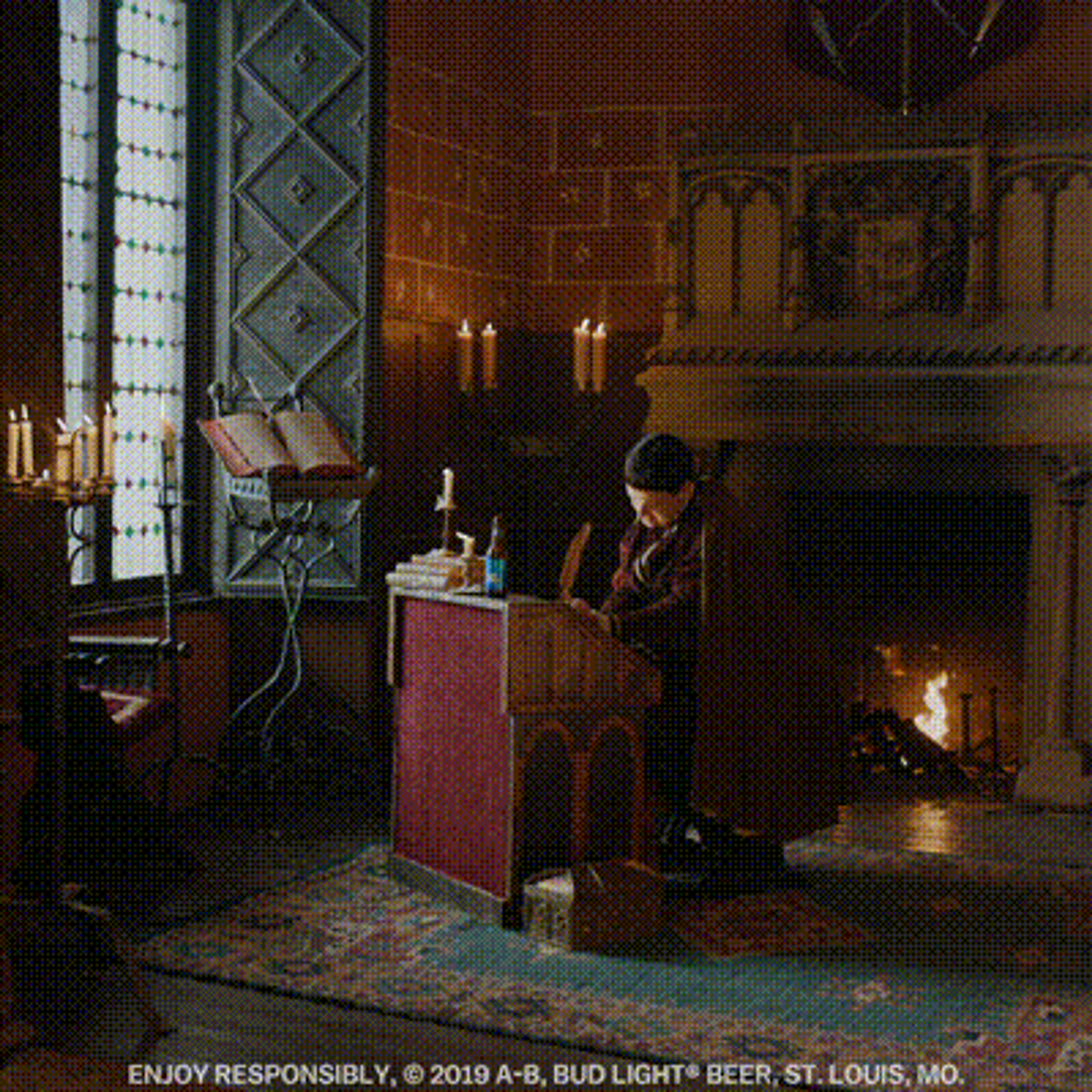 A man copying text at a lectern