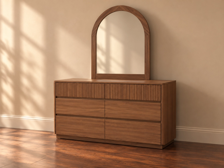 Wood dresser with reeded top drawers and an arched mirror.
