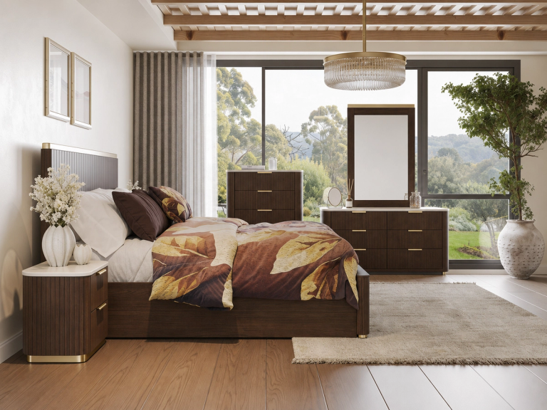 A modern bedroom with dark wood furniture and gold accents, leaf-patterned bedding, a slatted ceiling with a chandelier, and large windows overlooking a lush landscape.