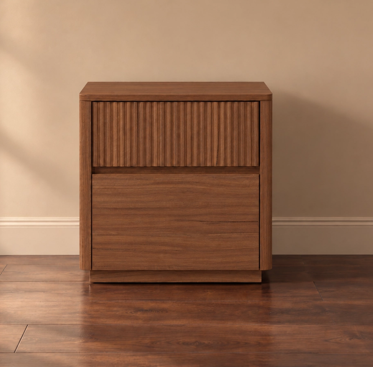 Wooden cabinet with a fluted top drawer and a smooth bottom drawer on a wood floor.