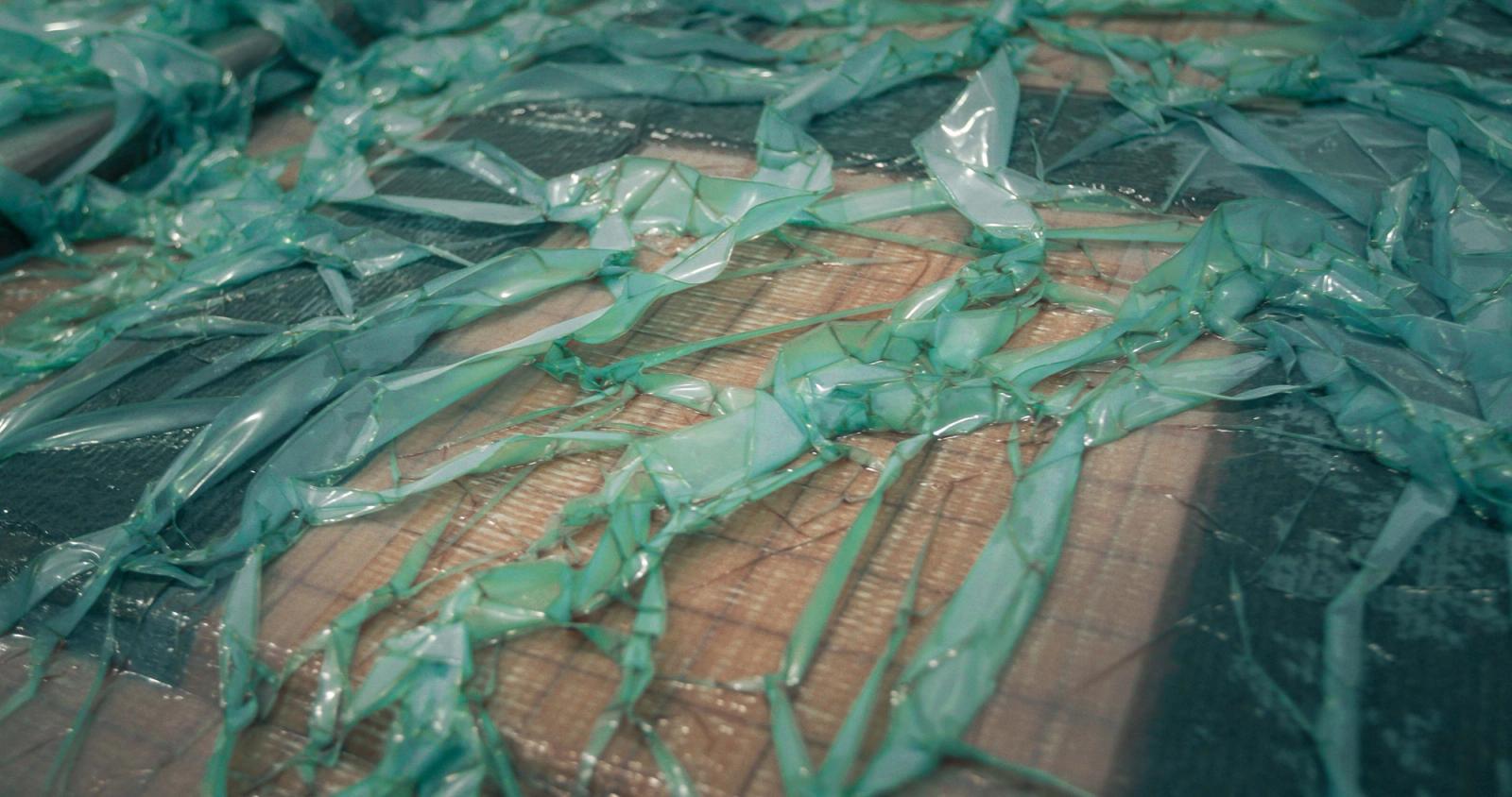 Vacuum-infused hatch waits for vinylester resin to cure.