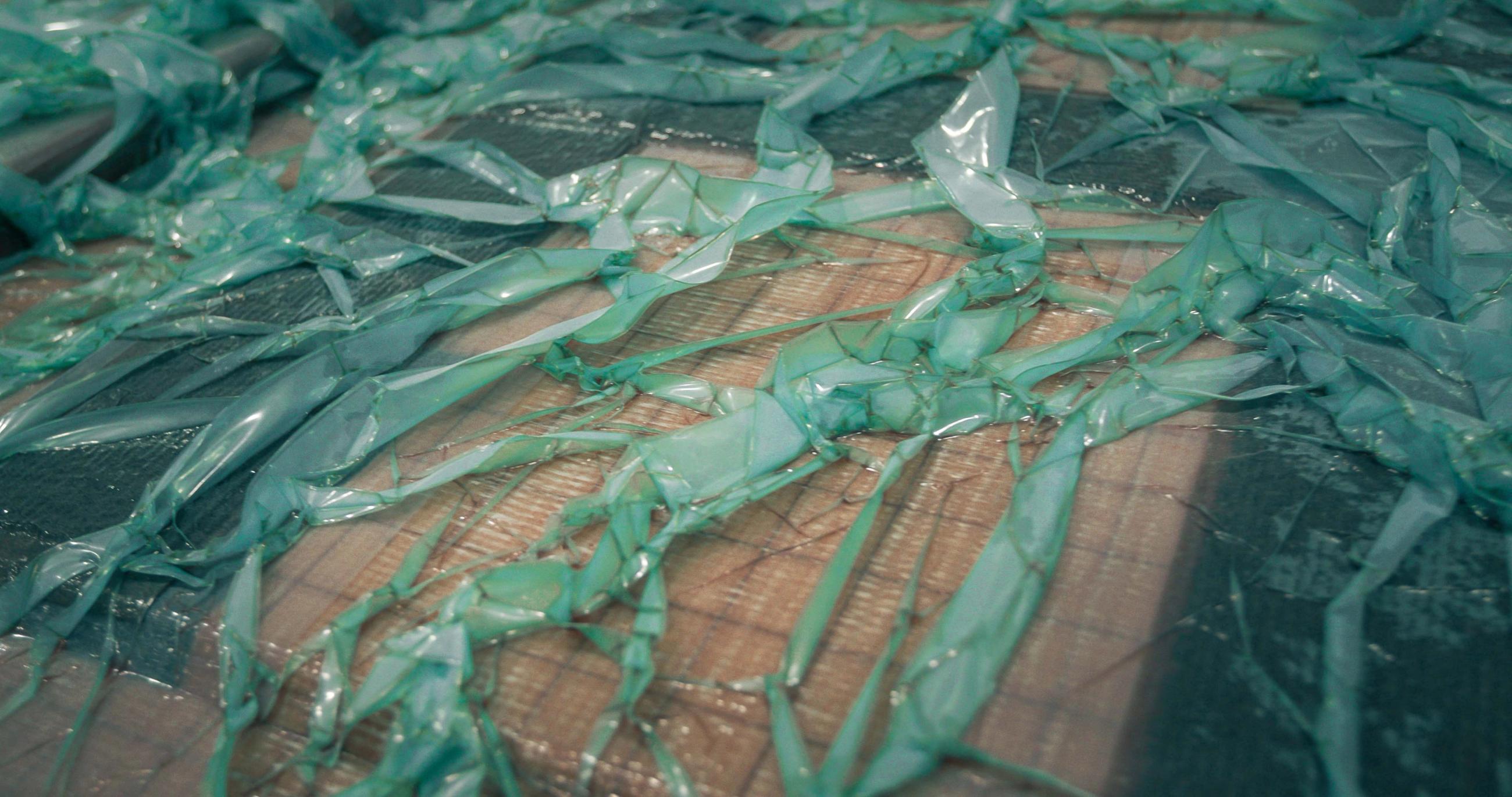 Vacuum-infused hatch waits for vinylester resin to cure.