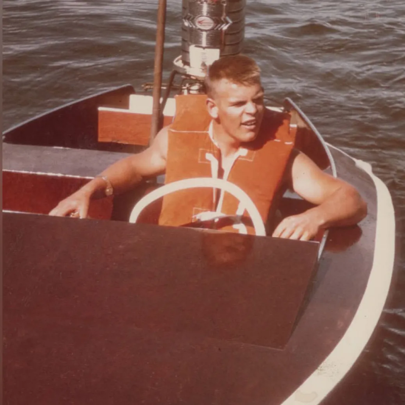 A photo of a young Jim lindell in a boat