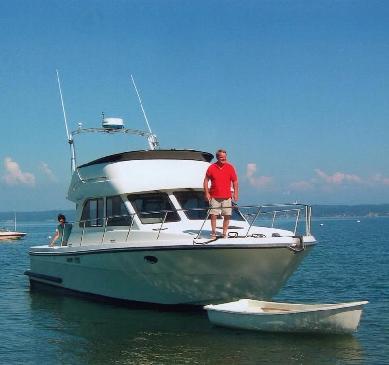 Jim Lindell standing on a boat.
