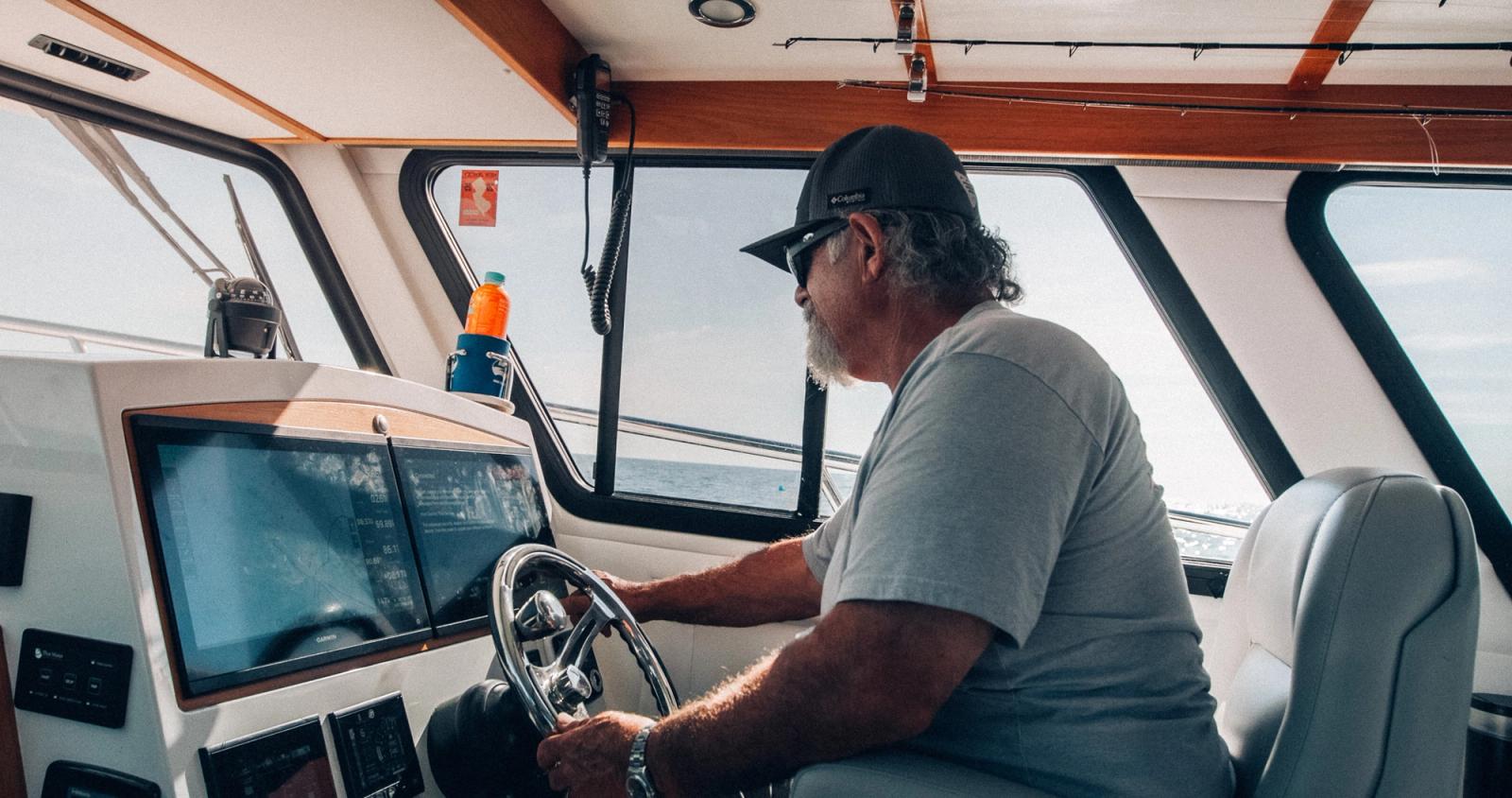 Captain at helm aboard the Lindell 41