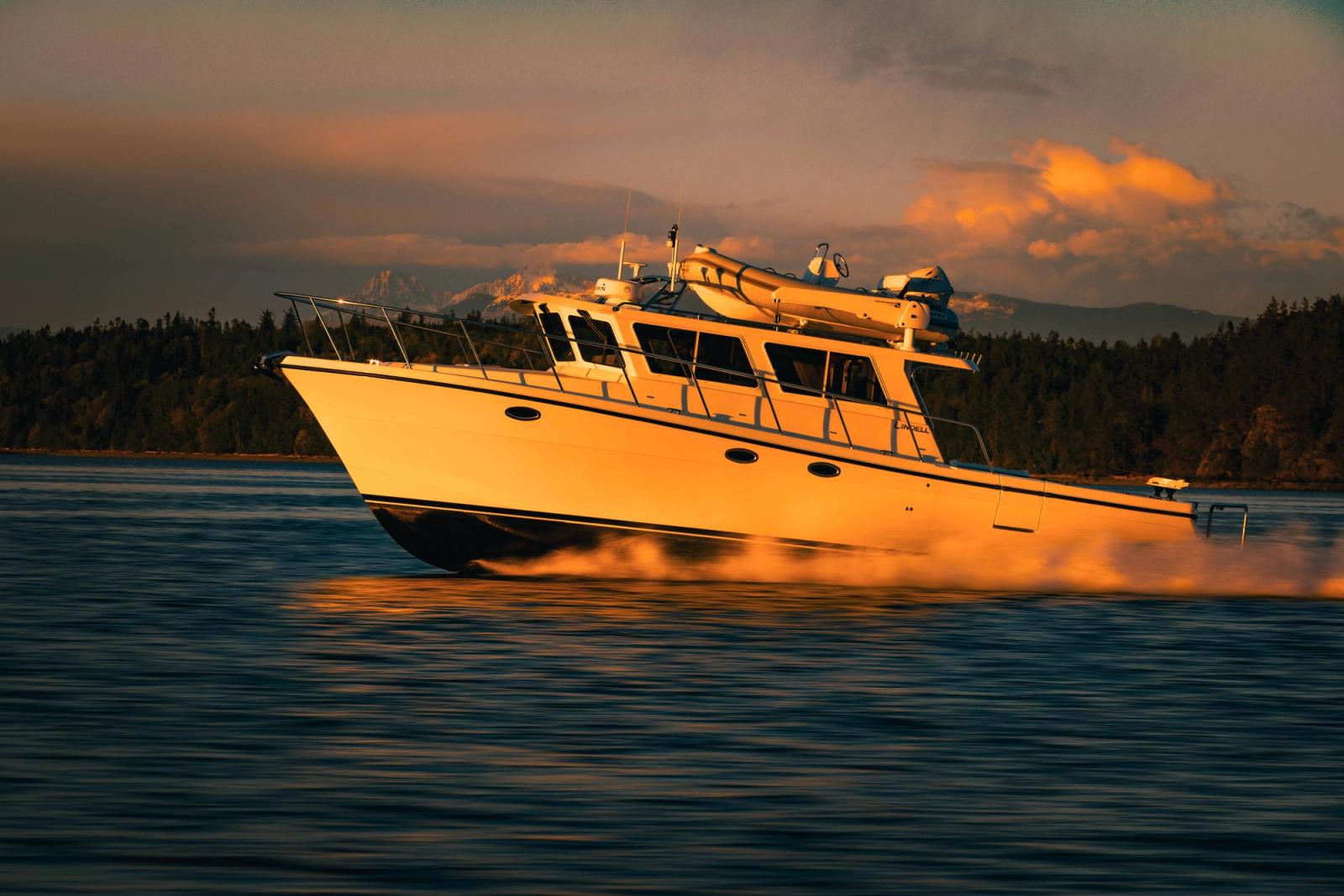 The Lindell 42' glowing in the sun with the mountains near La Conner Washington behind it