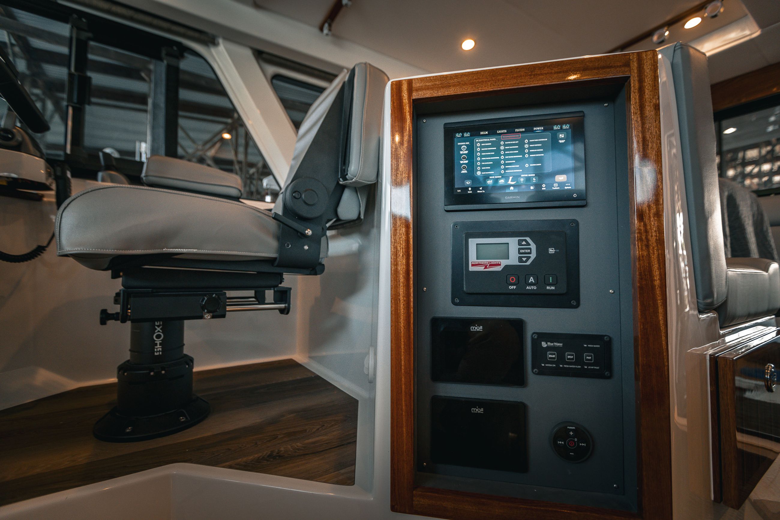 Digital Switching Control Panel behind the captain's helm in the pilothouse of the Lindell 48