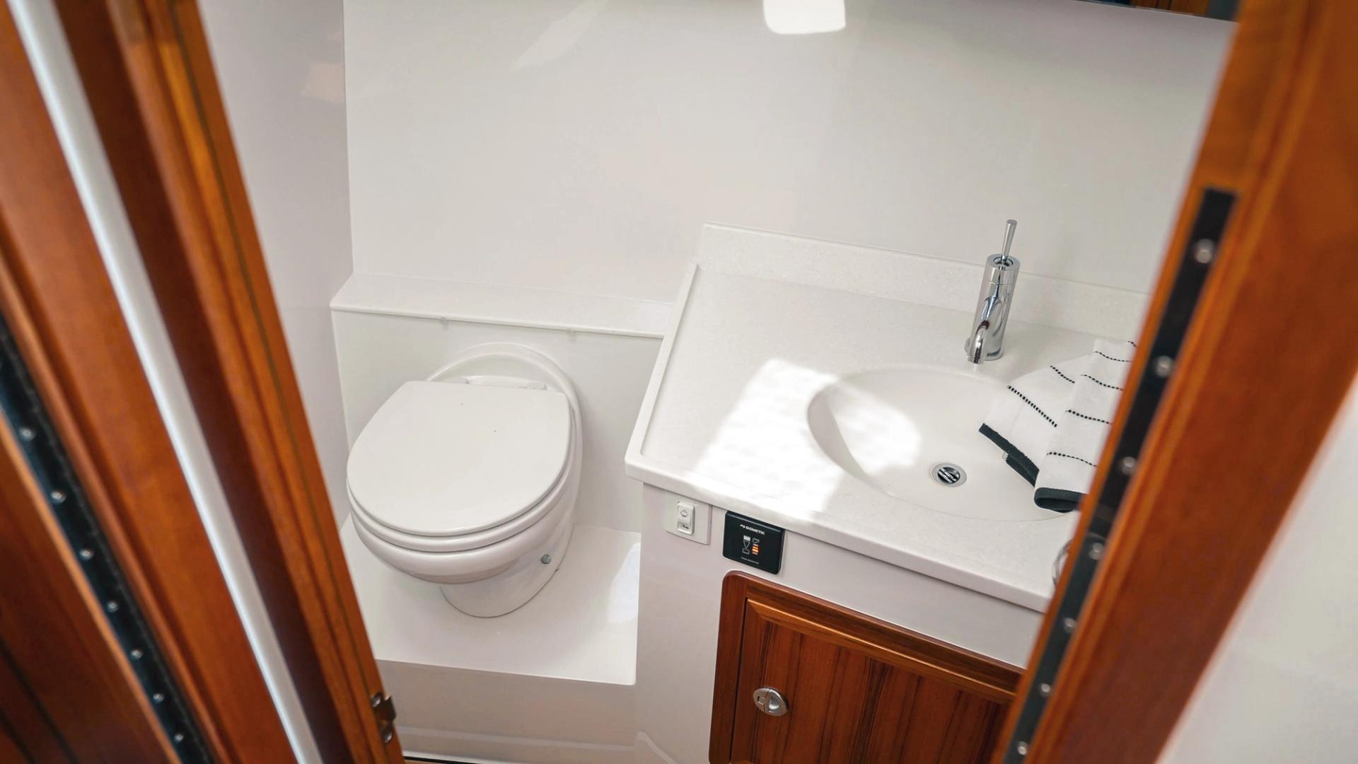 view of the lindell 41 head and sink on the starboard side