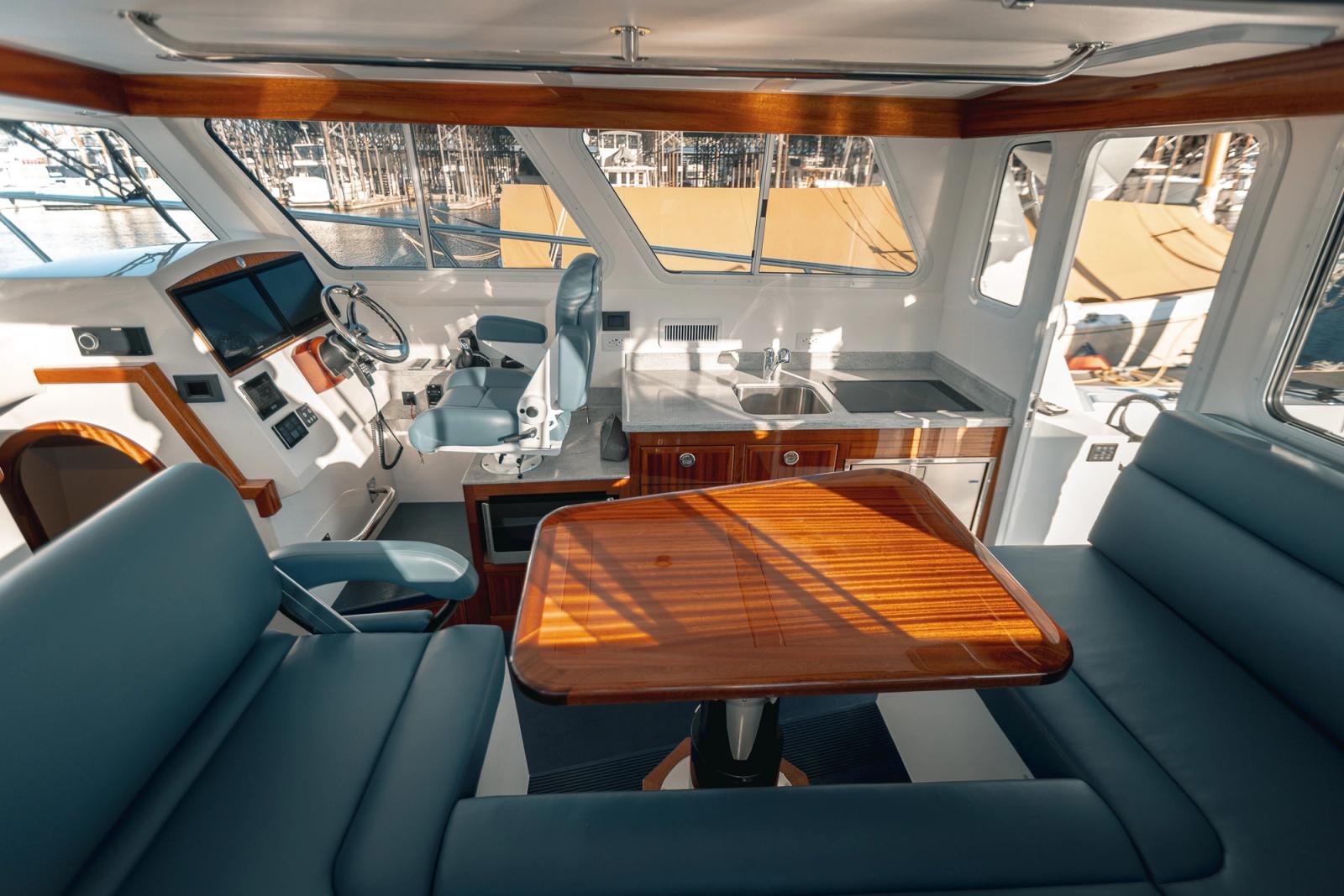 Pilothouse salon, galley, and helm of the Lindell 38' 