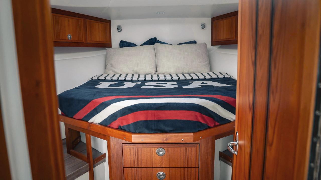 lindell 41 bow berth with a queen bed and USA bedspread