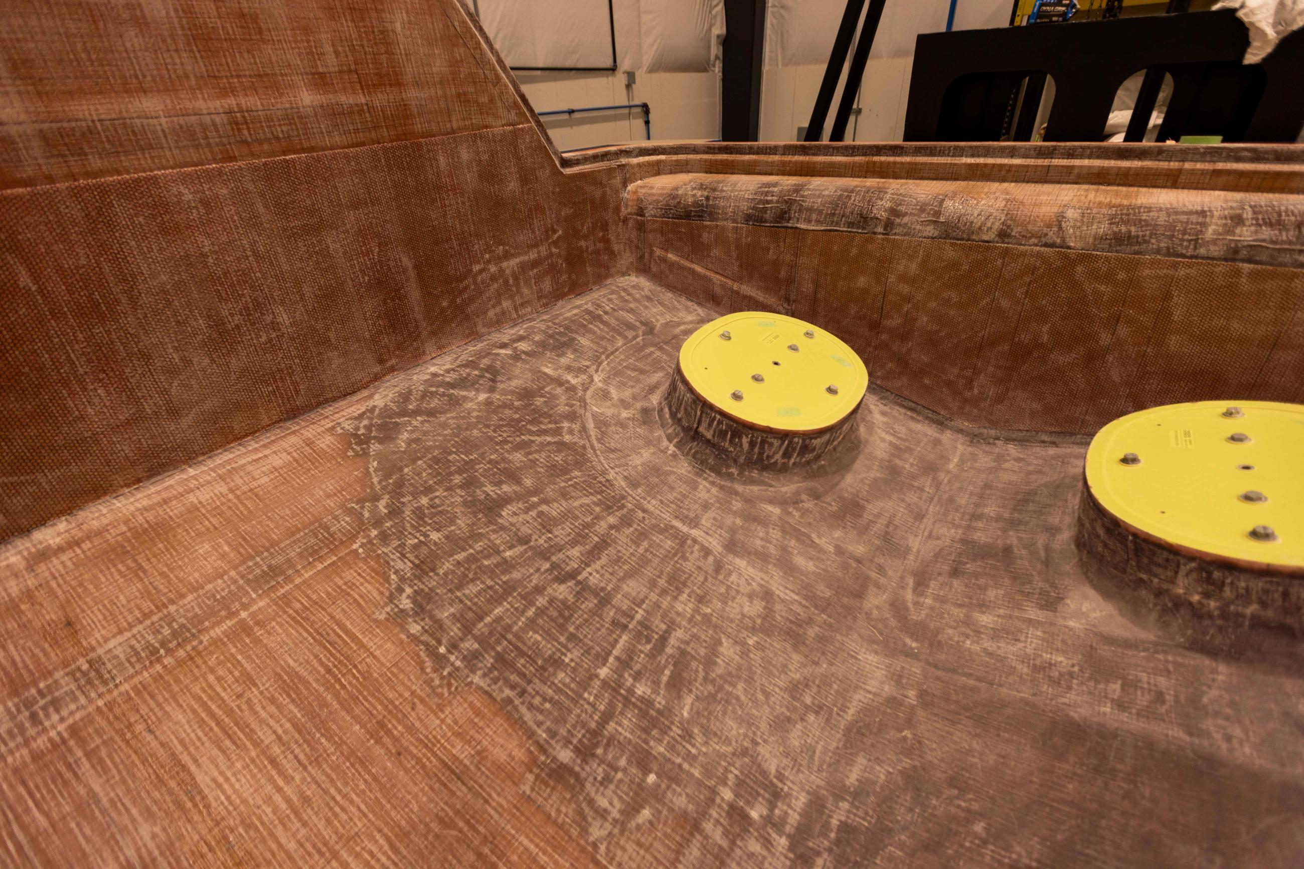 Layered vacuum-infused core around the Volvo Penta pods on a Lindell 42