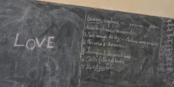 A blackboard with the word love written on it