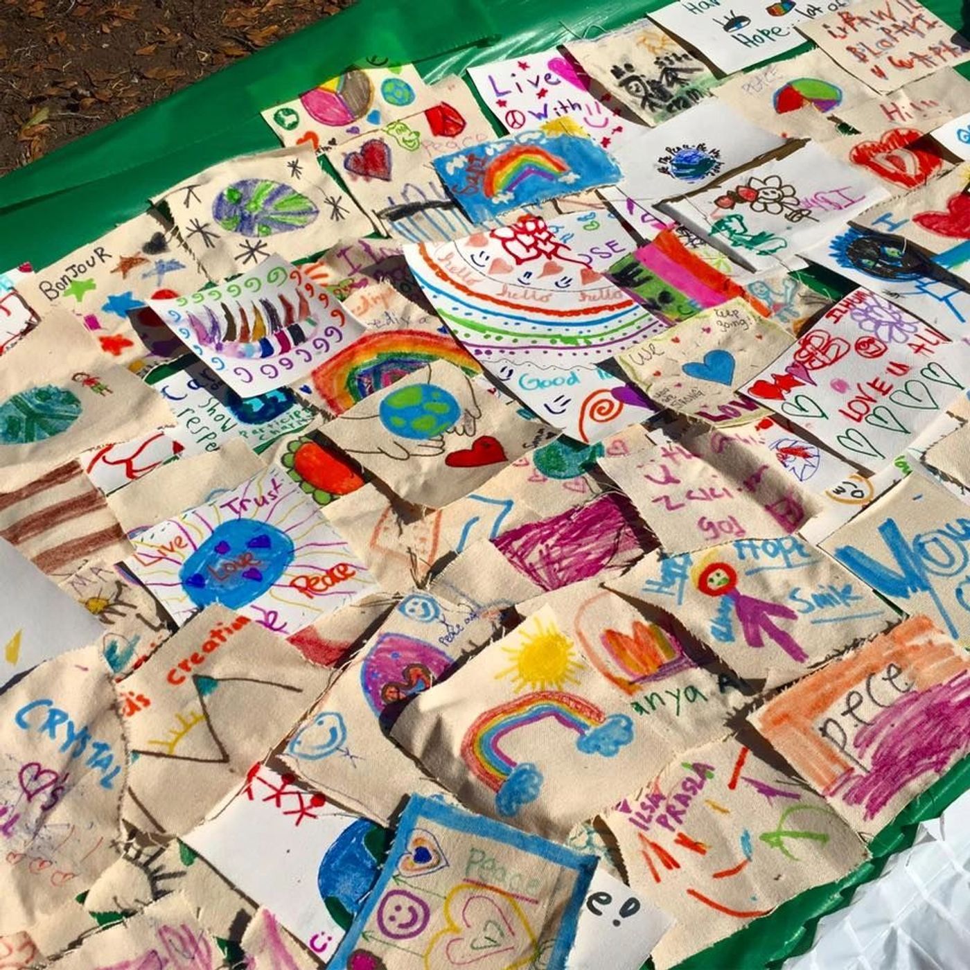 An art quilt of drawings and messages of hope made by Houston children