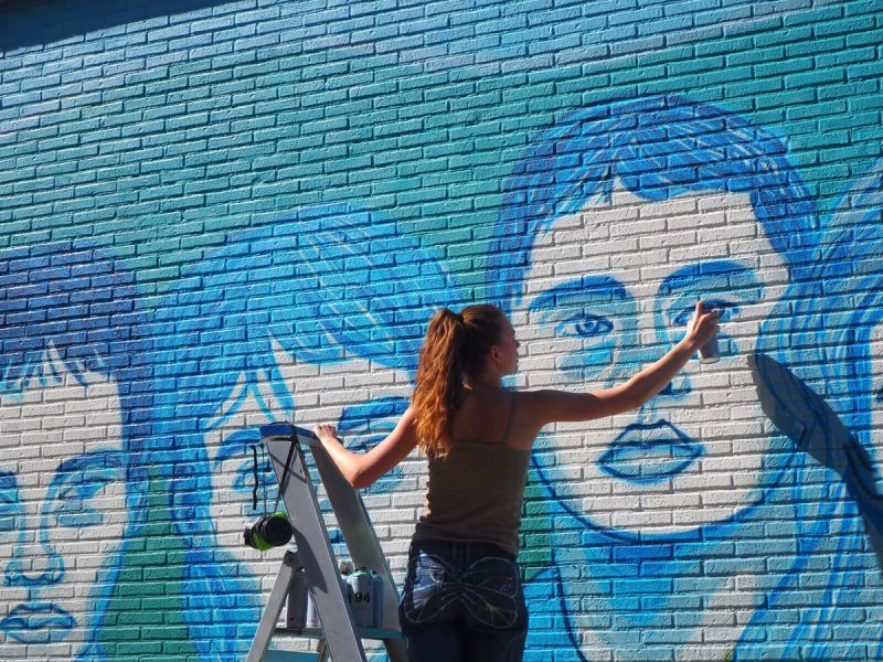 Amélie Zimmermann at work on the cut 11 percent mural