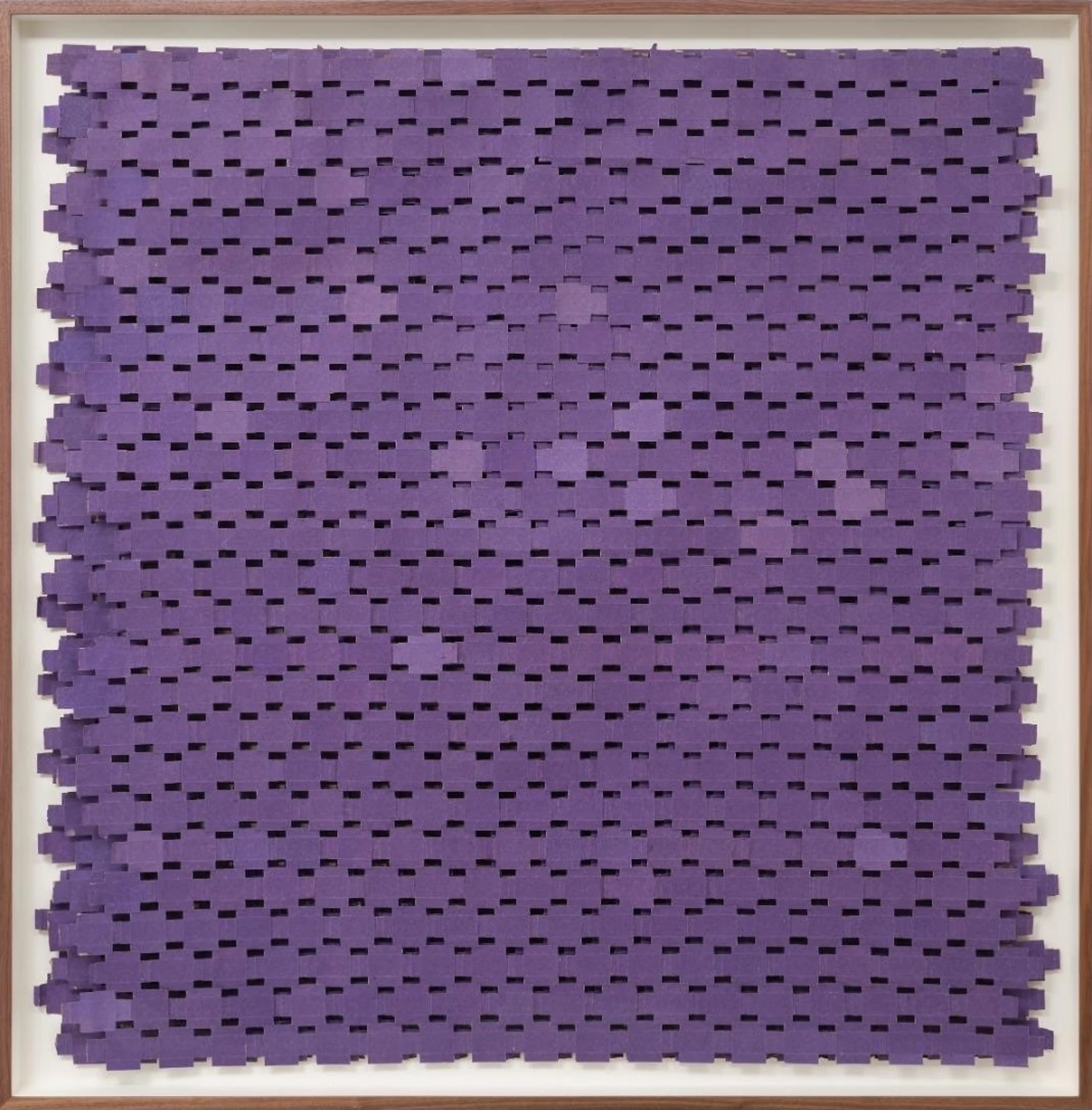 Large timber-framed square artwork behind glass, featuring purple unfolded matchboxes arranged in an overlapping grid.