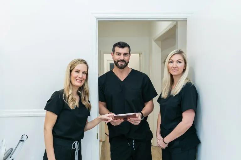 Physician at a medical spa speaking with patients