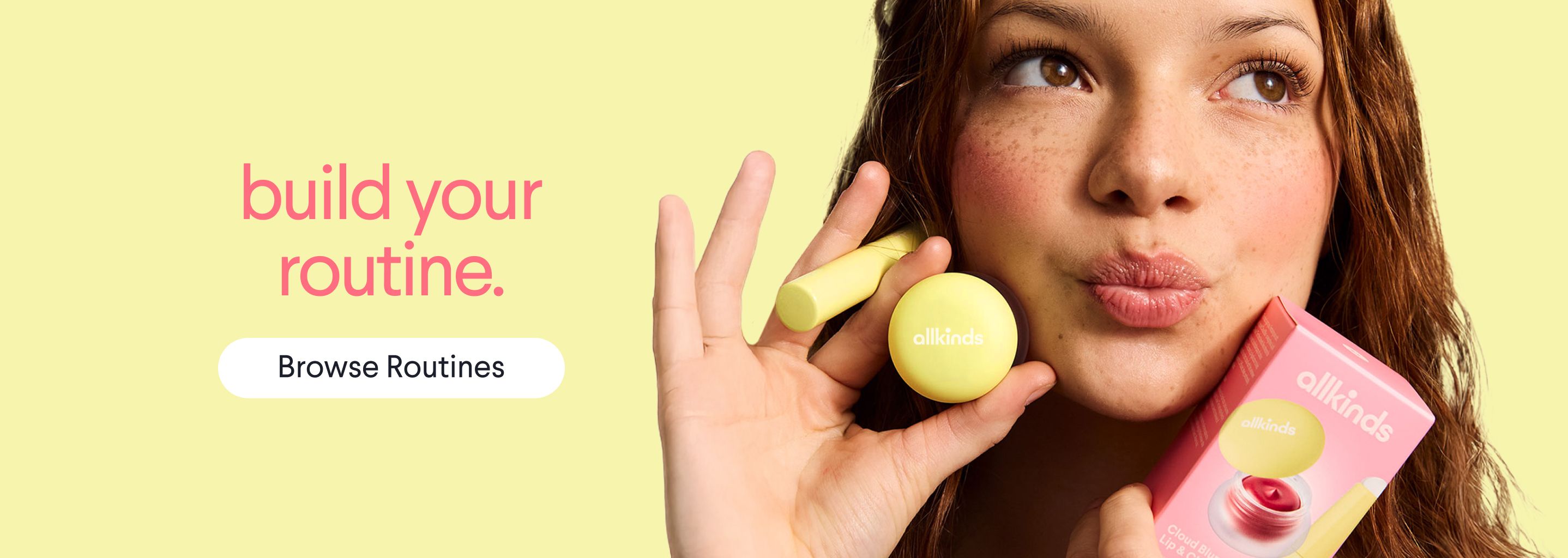 a woman is holding a lip balm and a box of lip balm .