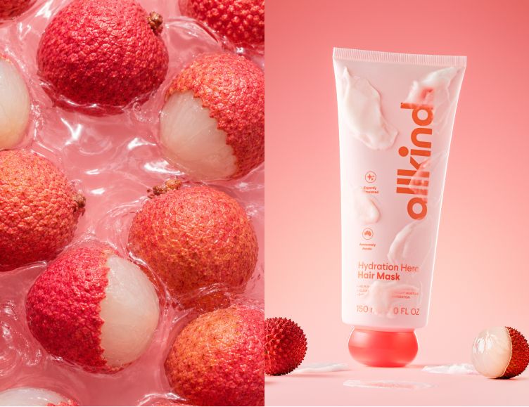 A pink tube of allkind Hydration Hero Hair Mask stands next to whole and peeled lychees on a pink surface, beside a close-up of lychees in a clear pink liquid.