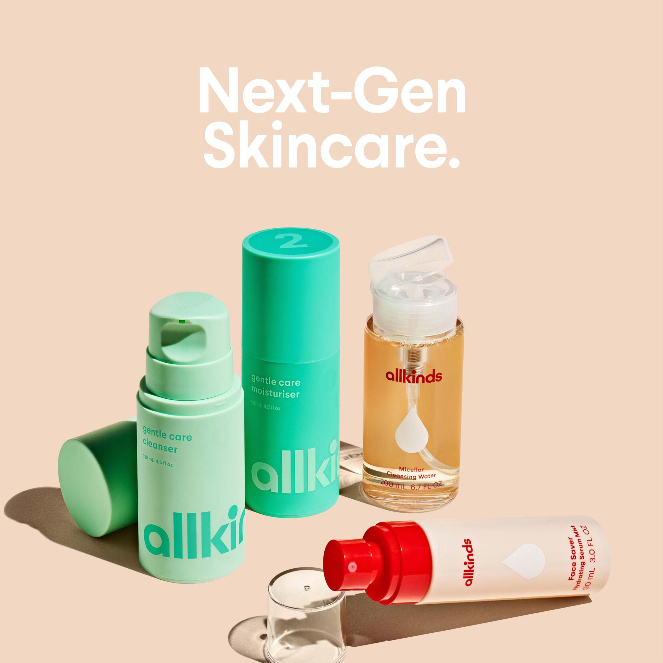 a bottle of allkinds next to two other bottles of skincare