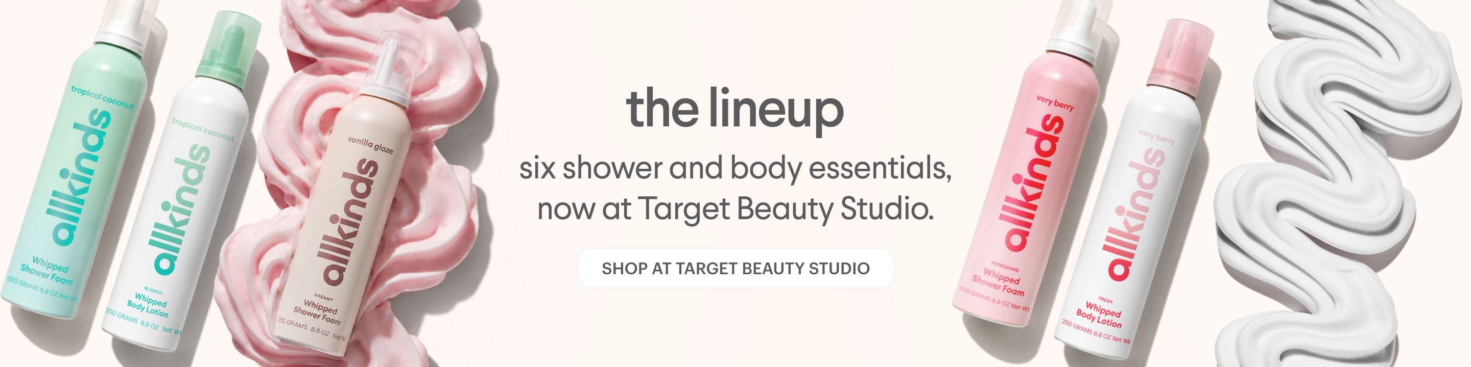 allkinds shower and body essentials banner featuring six colorful bottles and swirled foam, promoting their availability at Target Beauty Studio.