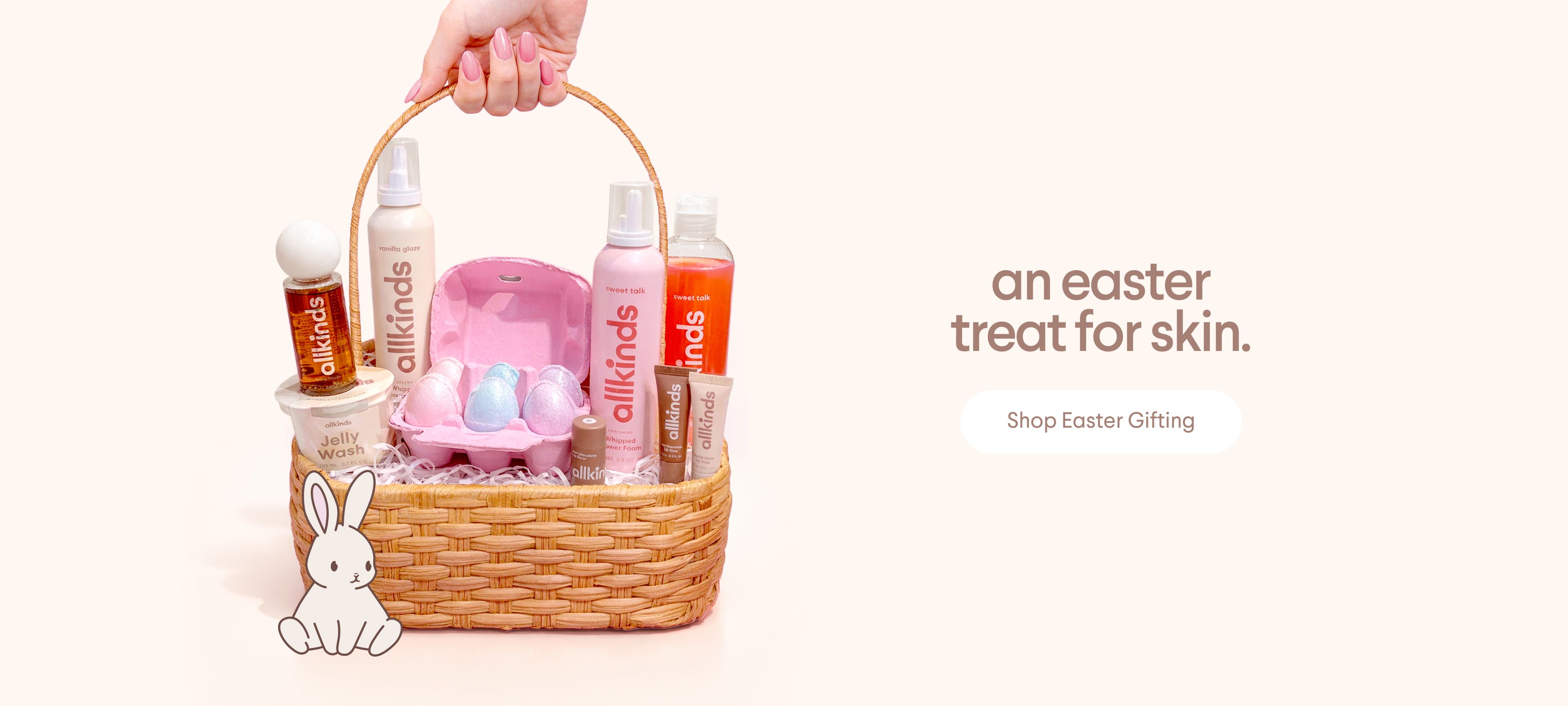 A hand holds a wicker basket filled with Allkinds skincare products and pastel Easter eggs, beside a bunny graphic. Text: "an easter treat for skin. Shop Easter Gifting."