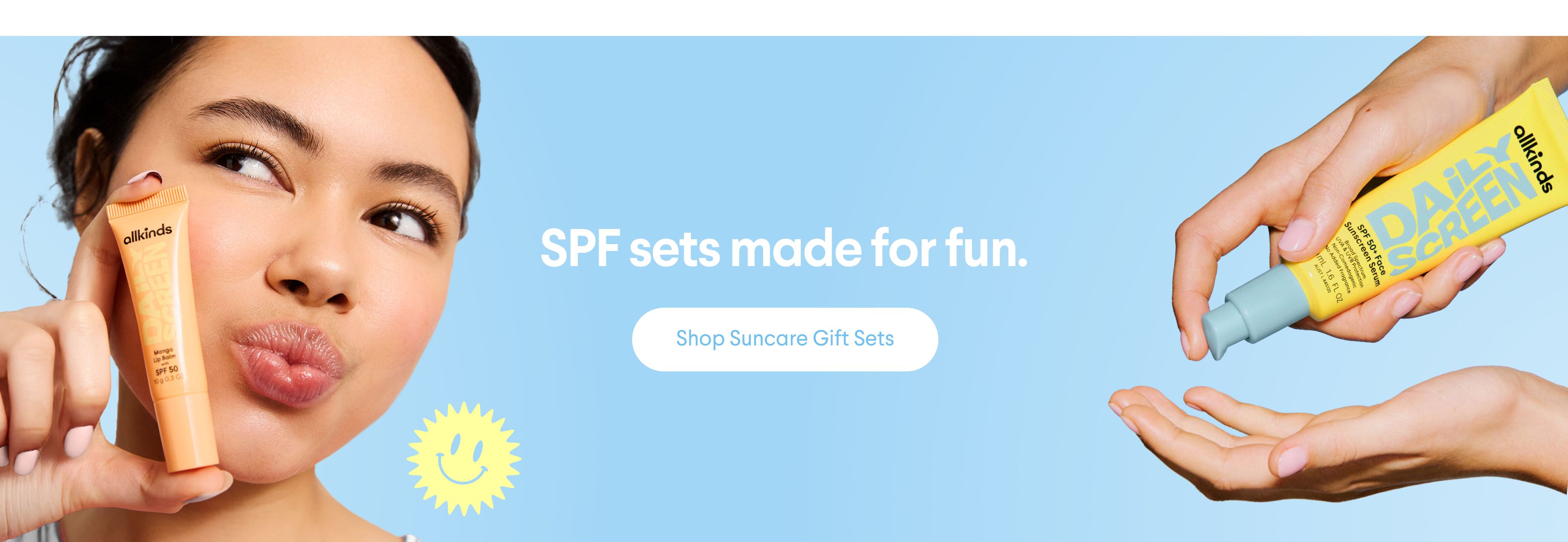 a man is holding two bottles of sunscreen in his hand .