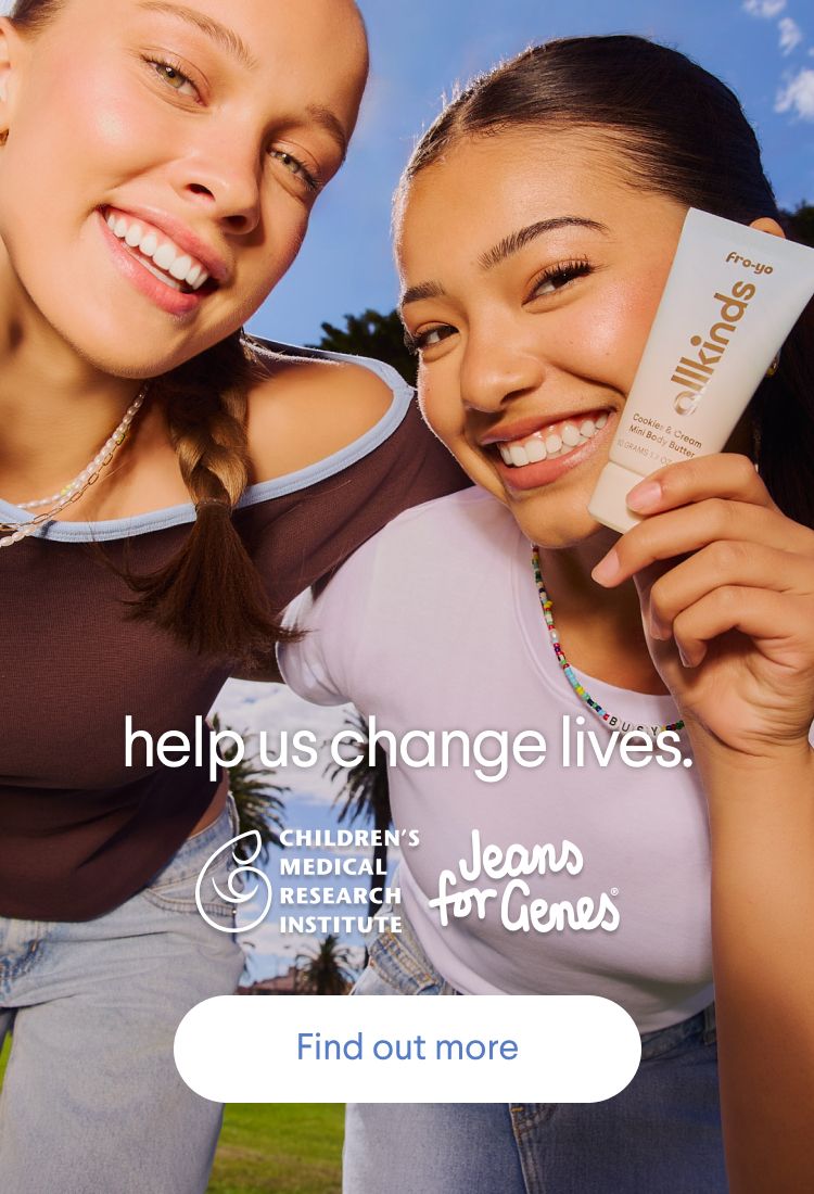 Two smiling young women outdoors, one holding an "allkinds Fro-yo Cookies & Cream Mini Body Butter" tube. Overlay text reads: "help us change lives," with logos for Children's Medical Research Institute and Jeans for Genes, and a "Find out more" button.